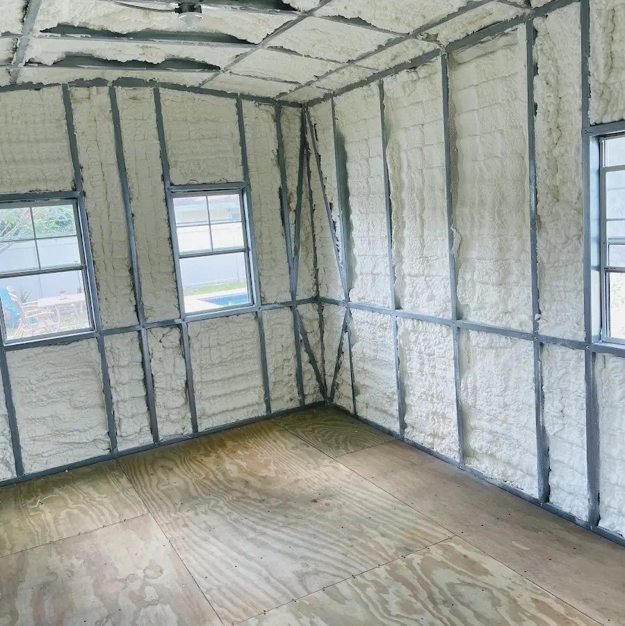 Closed-cell spray foam insulation applied to wall cavities in a residential project in Warwick